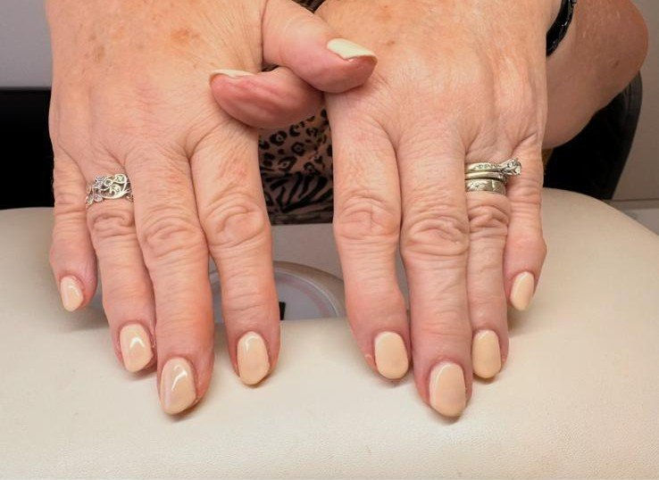 Nude Bio Sculpture gel nails on a hand
