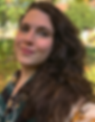 Photo of the author: a subtly-smiling woman with long wavy brown hair falling over her shoulder