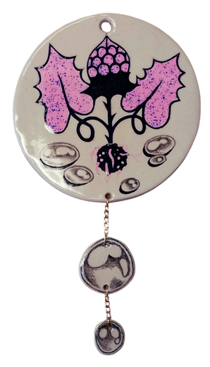 shiny ceramic modern wallhanging with plant and raindrops dangling below