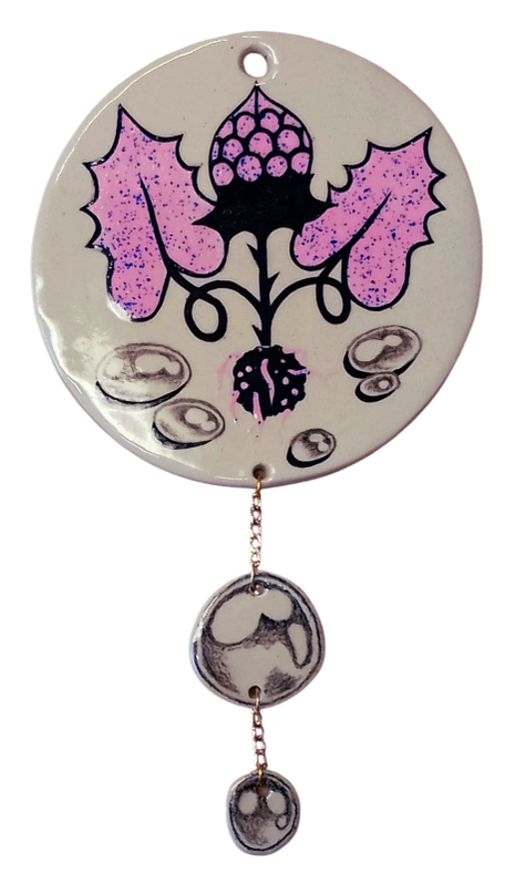 shiny ceramic modern wallhanging with plant and raindrops dangling below