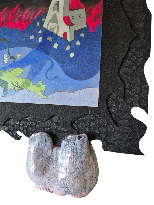 closeup of painted lizard-like texture on felted black frame with ceramic feet holding it up