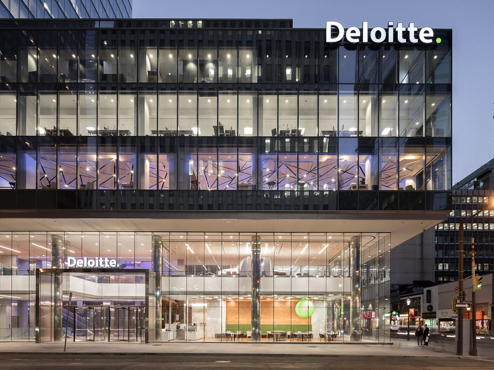 Eye-level view of the Deloitte building entrance at 8 Adelaide St W, Toronto