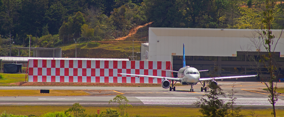 Jet blast deflector protecting a hangar and airplane apron at SKRG airport