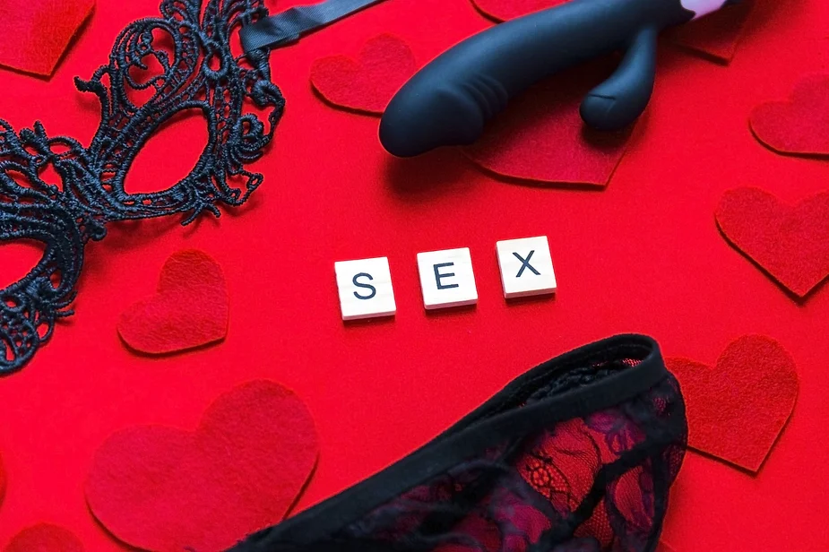 blacck sex toys and the word sex written to highlight orgasm after menopause