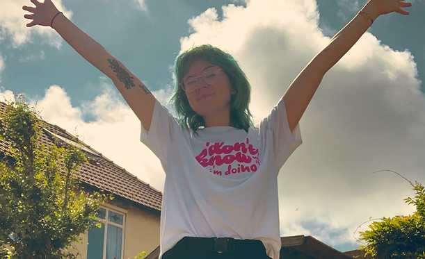Girl wearing Girly Gloom 'I Don't Know What I'm Doing' T-Shirt and smiling