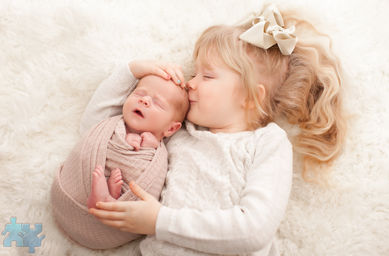 Oakville Newborn Photography - Toddler kissing her newborn baby sister