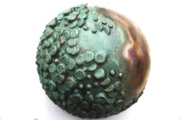 Example of Jackie's artwork: textured and patinated bronze orb