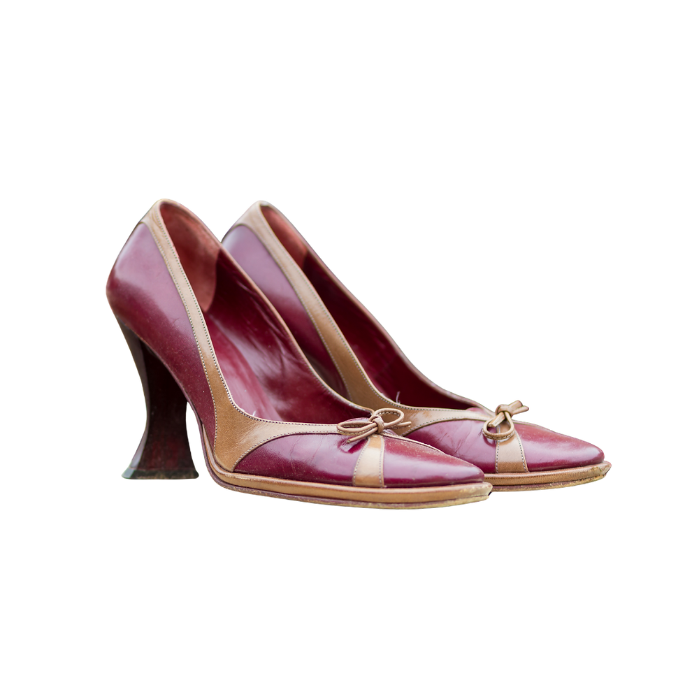 Red leather pumps with ivory trim
