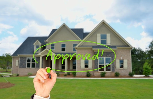 A home with an approved sign written over it.