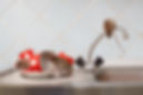 Three young rats (Rattus norvegicus) and red cups on sink in an apartment house on the bac