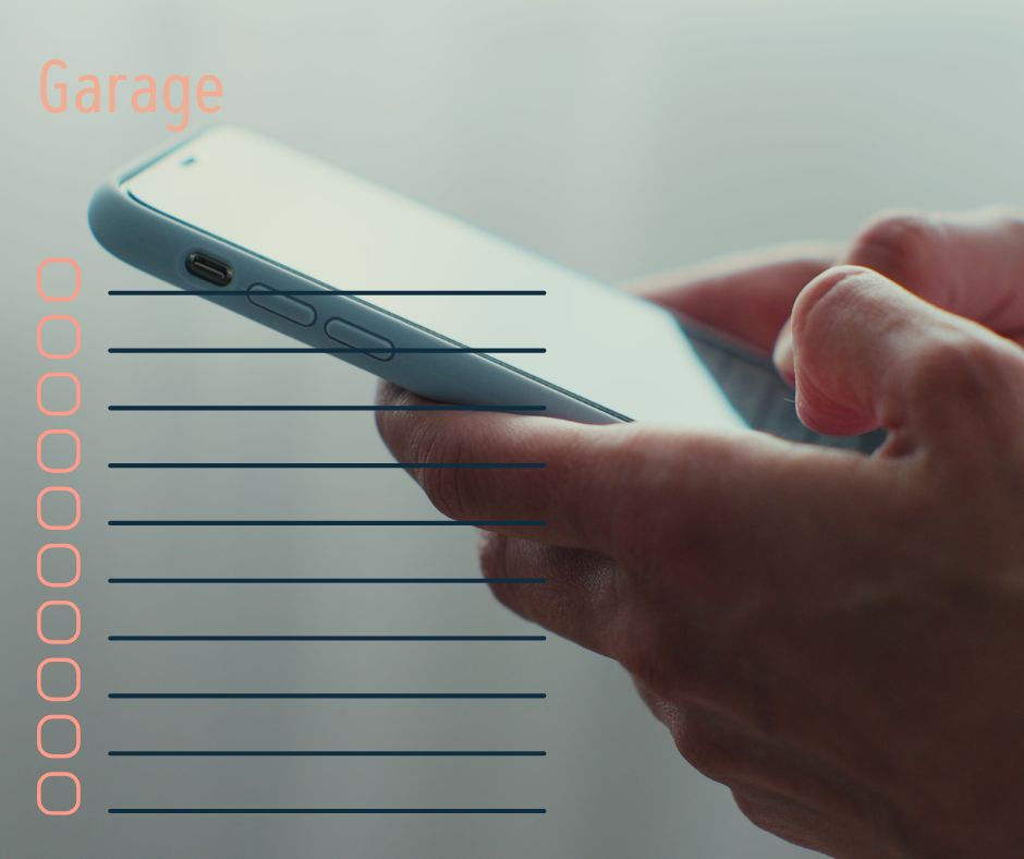 hands holding a phone typing in their garage inventory