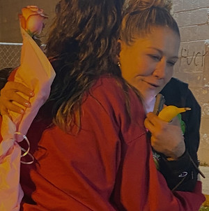 Two people hugging