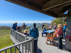 EAC members on a porch overlooking mountains