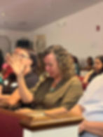 Church member praying during the sermon