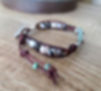 Thumbnail:   Silver sand dollar button and striped agate ladder bracelet