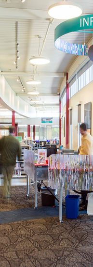 A library space with an information desk. 
