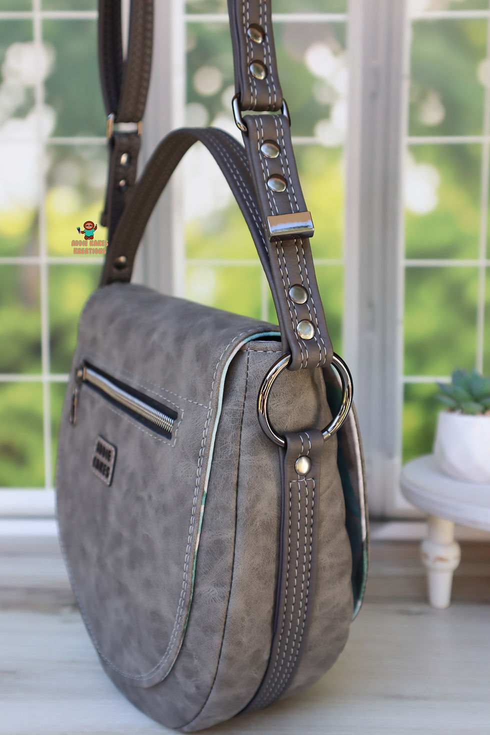 Thumbnail: Gray Geometric Meridias Saddle Bag