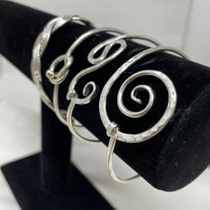 a large collection of handcrafted silver jewelry 