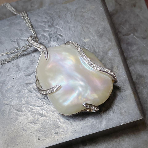 large, baroque pearl pendant with white sapphires 