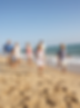 family having fun at beach