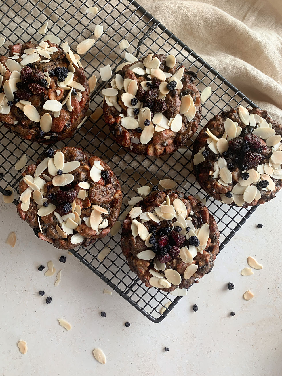 Recipe from Erin Hall ~ Clinical Nutritionist at The Longevity Nutritionist. We know, it's still November... but in our opinion it is never too early to get festive and enjoy those classic Christmas foods we all love! This Christmas cake isn't your typical fruit cake, it is dairy, gluten and refined sugar free as well as being paleo, making it a great low allergen option. The fruit used is free from preservatives and extra added sugar, fruit is sweet enough! This cake is high in beautiful plant based fibre and protein making it gut friendly. We hope you love it. Healthy Christmas Cake. Makes six mini cakes or one big one. Ingredients: 650g sugar-free dried fruit (chopped) including cherries, strawberries, pitted dates, black currants and Turkish apricots. You can adapt this as you please though. 1 teaspoon ground cinnamon 1/2 teaspoon ground nutmeg 1/2 teaspoon ground cloves 1/2 teaspoon ground ginger 2 teaspoons vanilla extract 1/4 teaspoon bicarb soda 1 tablespoon chia seeds 3 organic eggs 1 orange (zest and juice) 3 tablespoon extra-virgin olive oil 1/2 cup buckwheat flour 2 cups almonds 1/3 cup walnuts 1/4 cup almond flakes (for topping) Method: Preheat oven to 160°C fan forced. Lightly spray 6 mini cake tins OR one big round tin with olive oil and set aside. In a bowl, lightly fold dried fruit, spices, vanilla, chia seeds and bicarb. Combine eggs, olive oil, orange juice and zest. In a blender or food processor, pulse almonds and walnuts into a crumble consistency. Add crumble and flour to the remaining mixture and combine well. Spoon mixture into the baking tins, adding almond flakes for decoration. Bake for 45-50 minutes, or until your cake skewer comes out clean. Add crumble and flour to the remaining mixture, combine well. Spoon mixture into the baking tins, adding almond flakes for decoration. Bake for 45-50 minutes, or until skewer comes out clean. Let us know in the comments if you make and love this recipe! For more delicious nutrition information and recipes, visit https://www.thelongevitynutritionist.com.au/journal