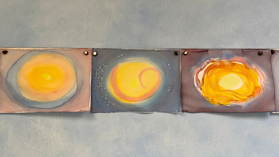 Blurred art panels with circular yellow patterns on blue backgrounds. Soft pastel colors create a calming, abstract effect.