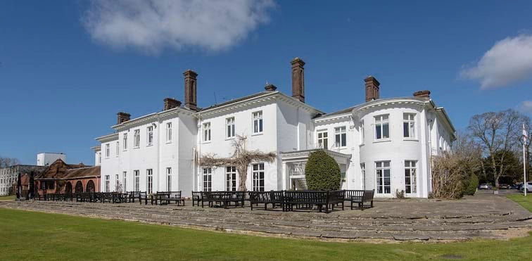 Commercial EPC | Hotel & Conference Venue | Historic Property
Set within 22 acres of Oxfordshire parkland, Milton Hill House is a distinctive hotel, conference and events venue near Abingdon, combining a historic Georgian manor house with extensive modern accommodation and leisure facilities.
The Project
British EPC was appointed to undertake the Commercial Energy Performance Certificate assessment for Milton Hill House, a substantial and diverse hospitality property incorporating hotel accommodation, meeting and conference facilities, restaurant and leisure areas.
The property presented an interesting assessment due to the combination of the historic manor house and later modern additions, together with the range of different uses and building services operating throughout the site.
The Assessment
British EPC carried out a detailed survey of the property, reviewing the construction and thermal characteristics of the building alongside its heating, cooling, ventilation, hot water and lighting systems.
Assessing a property of this nature requires an understanding of both traditional construction and modern commercial building services, ensuring that the different areas of the hotel and conference facilities are accurately represented within the final energy assessment.
The Outcome
British EPC successfully completed the Commercial EPC assessment and certification for Milton Hill House, providing a comprehensive assessment of this substantial Oxfordshire hospitality asset.
The project demonstrates our experience in assessing large hotels, historic properties and complex multi-use commercial buildings, where different periods of construction and a wide variety of building services must be considered as part of a single coordinated assessment.