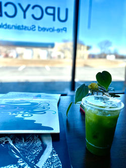 Photo of Upcycled in Gaithersburg, featuring a record and iced coffee