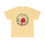 Thumbnail: Light yellow t-shirt featuring Santa Claus in a festive wreath with lights and gifts.