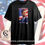 Thumbnail: Black t-shirt, John F. Kennedy portrait, 'JOHN F. KENNEDY', American flag background.