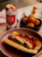 Lone Star Beer with a hot dog and fried bites photographed for a Fourth of July rooftop dining promotion.