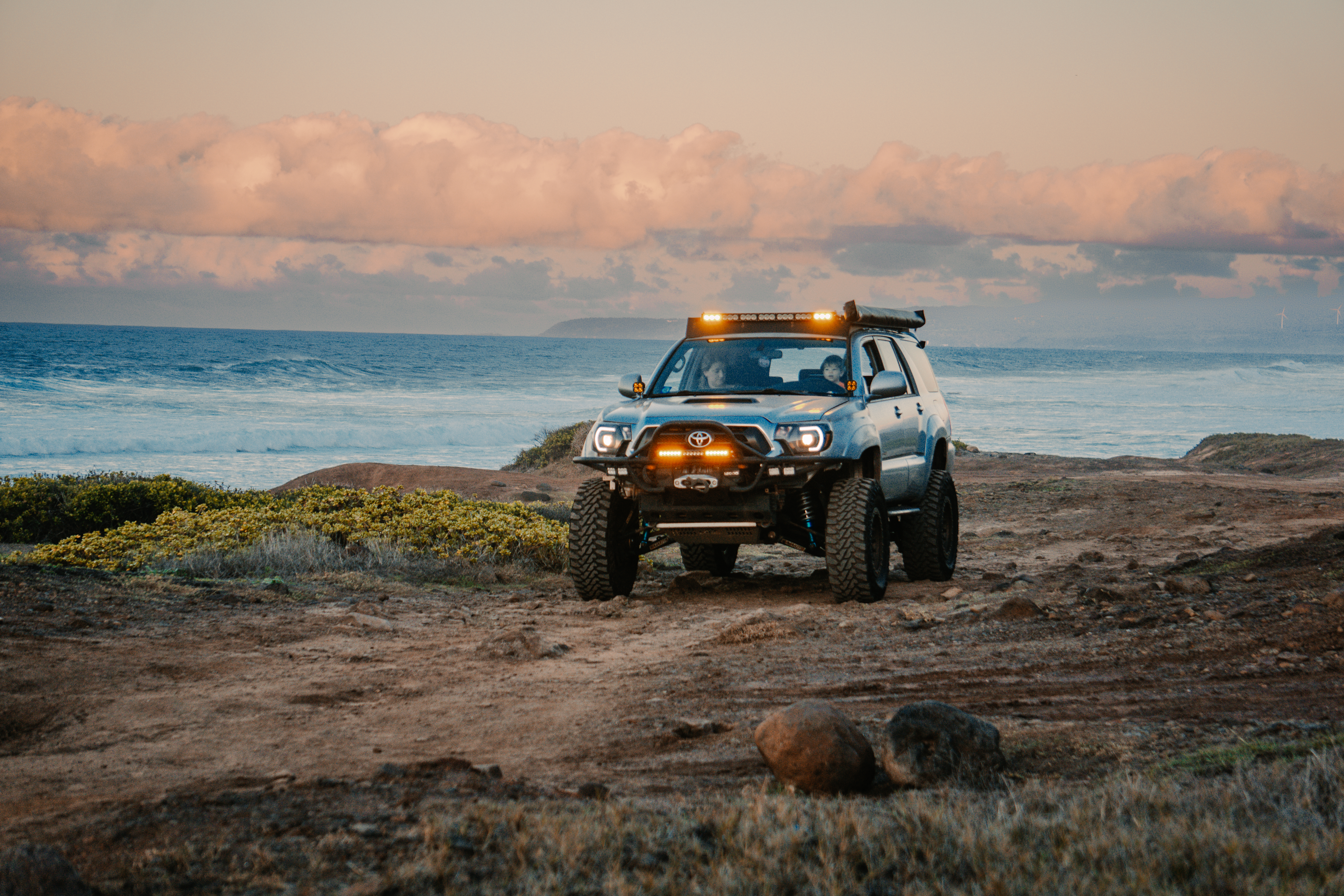 Nomadik 4Runner on a coastal trail at sunset