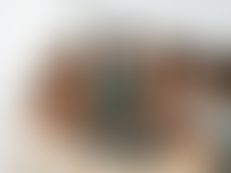 A diverse group of children collaborating safely on a large digital tablet in a bright, minimalist Scandinavian-style room, focusing on a supervised Roblox interface.