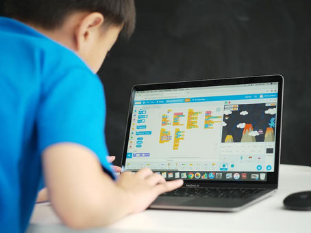 A child working on a laptop and building digital skills