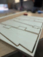 Precision machined panel on CNC router bed.