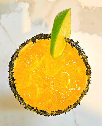 Mango Mezcal Cocktail
Mango slow-poached in saffron, lifted with smoky mezcal. Sweet, golden, and just a little wild.