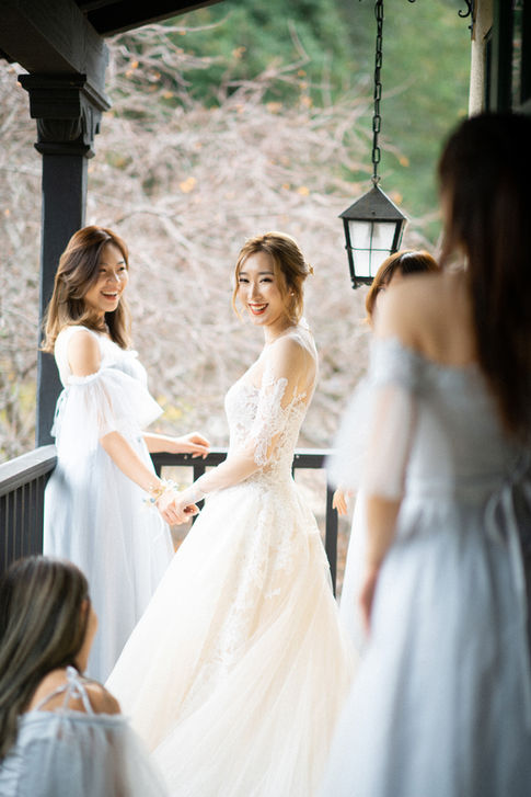 Beautiful Asian bride and her bridesmaid grou[