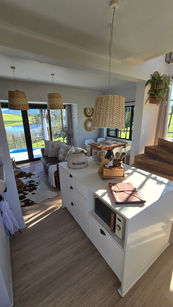 Modern living room and kitchen with a beautiful lake view