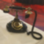 A black vintage style audio guestbook phone.