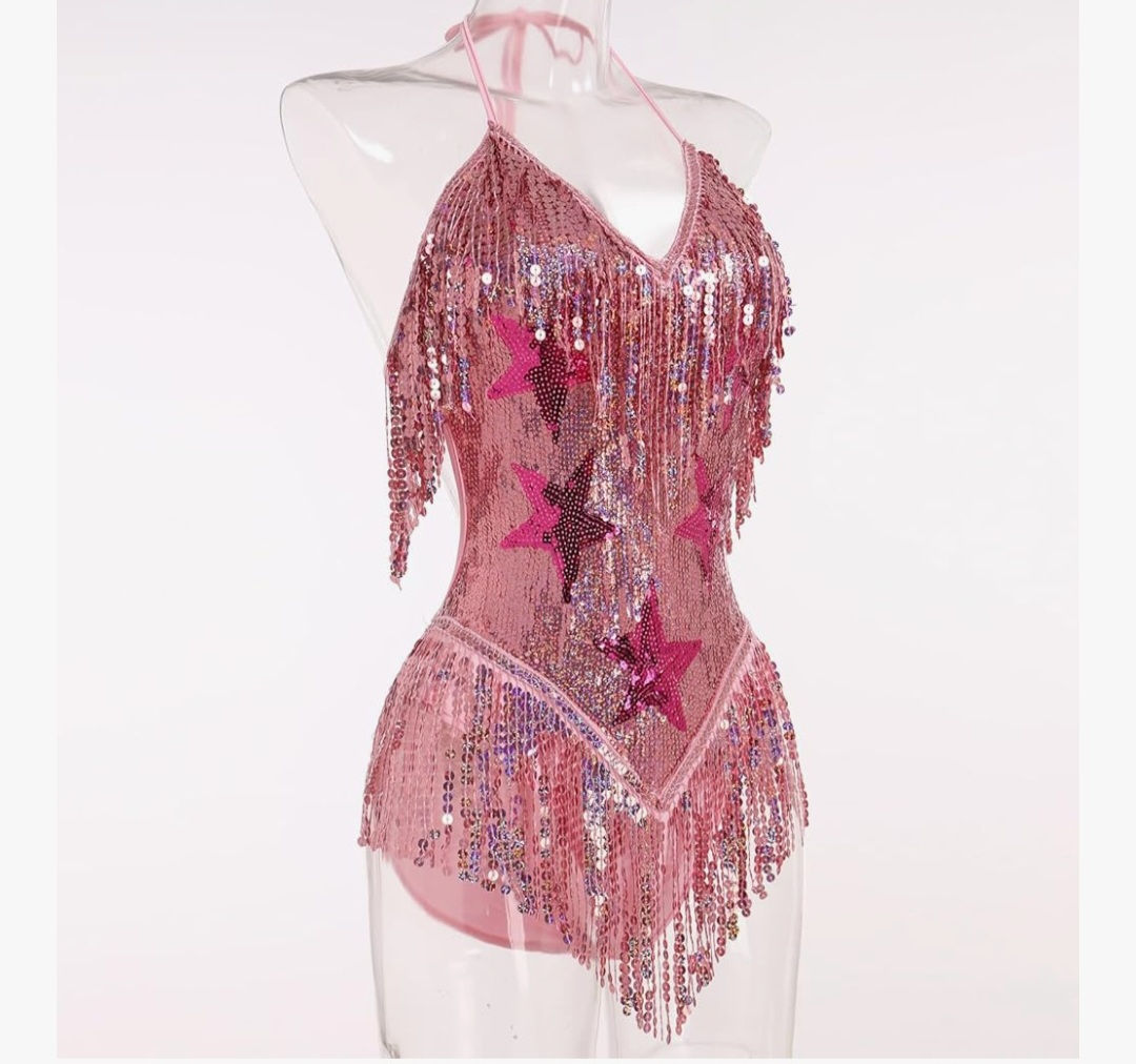 Pink sequined halter neck leotard with fringes and stars on mannequin.