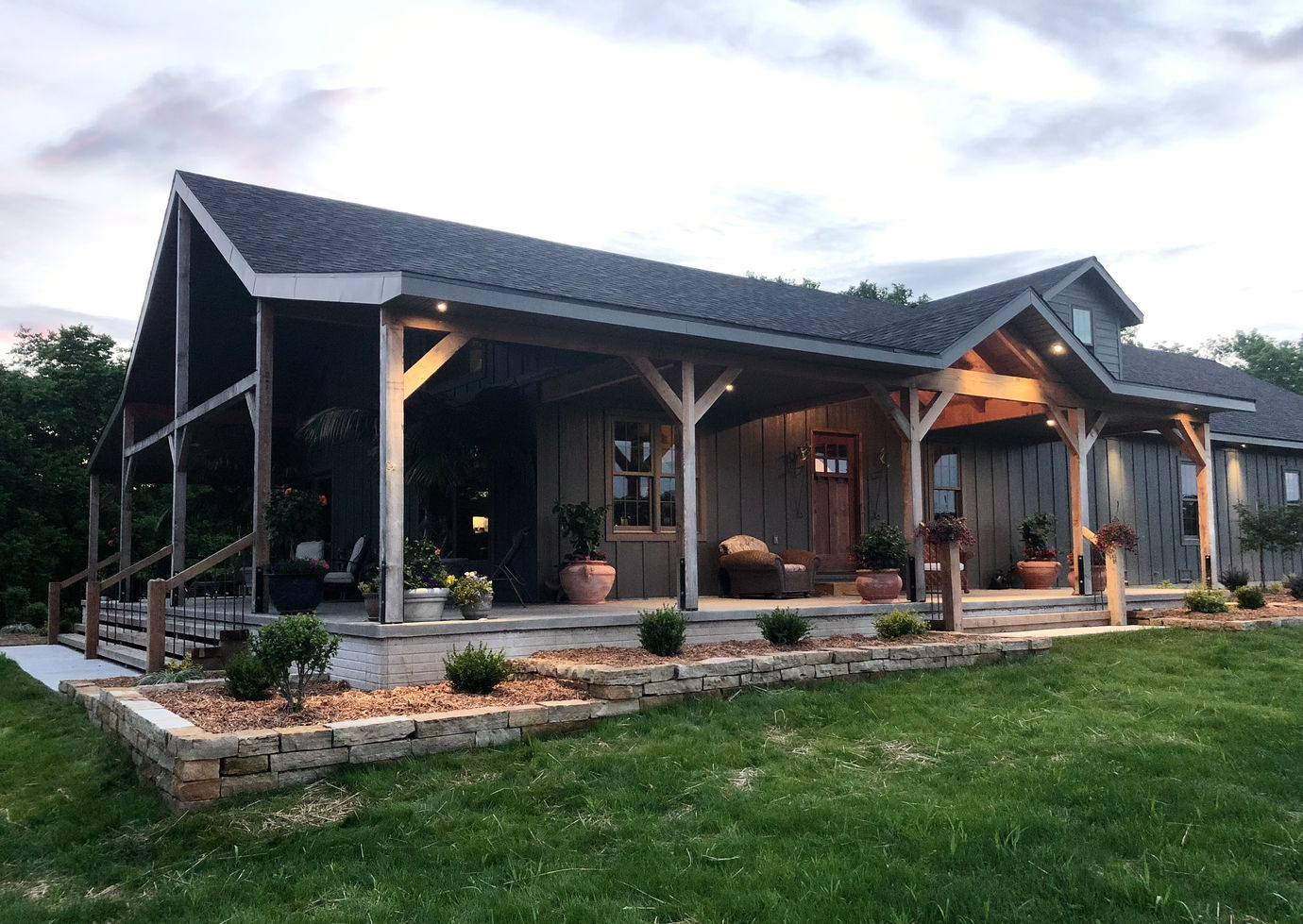 house with porch and landscaping by Phillips Custom Homes