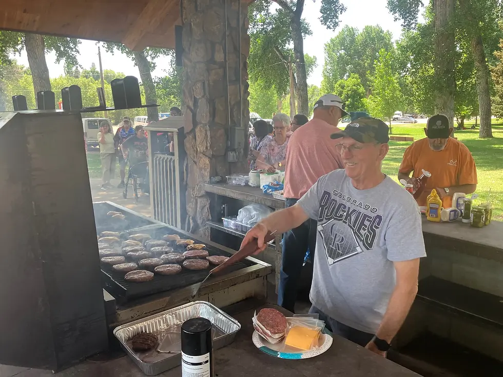 Lander's own Ron Grogan flipping burgers for a full crowd of CES clients, staff and families