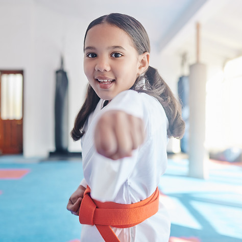 little-girl-learning-big-lessons-shot-cute-little-girl-practicing-karate-studio.jpg