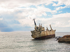 abandoned-broken-ship-wreck-beached-on-rocky-sea-s-2023-11-27-04-51-43-utc.jpg