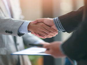 businessmen-handshaking-happy-with-work-handshake-2023-11-27-05-21-12-utc.jpg