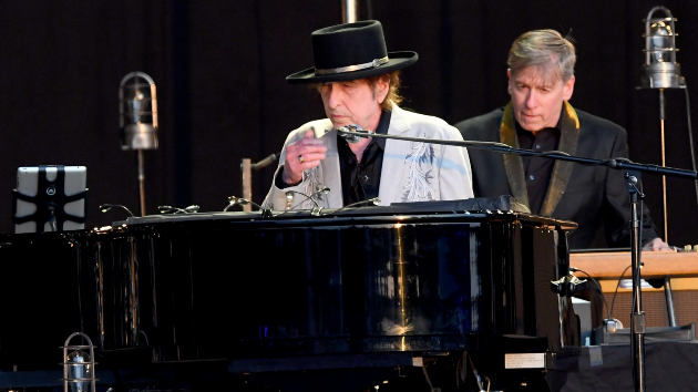 Bob Dylan at a piano on stage