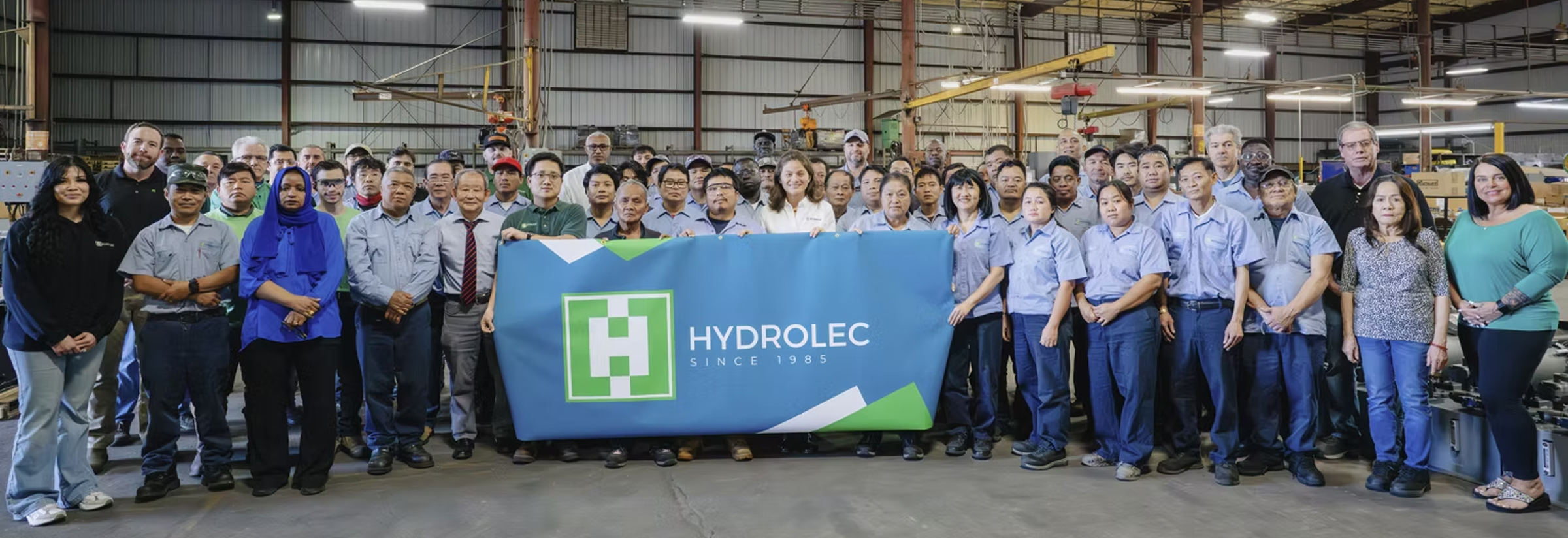 The Hydrolec team at the Jacksonville, FL facility, holding a Hydrolec Since 1985 banner.
