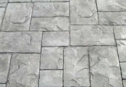 Stamped concrete patio design by Bluebird Design & Landscape in Castle Rock