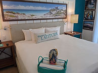MIRRC Paradise Room bed and flip flops.jpg