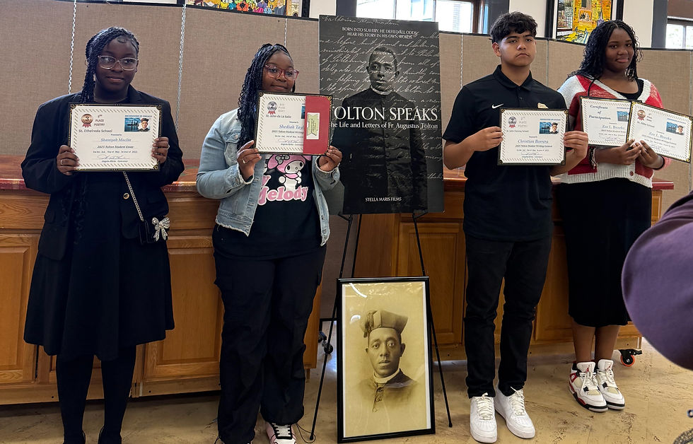 Second place winners, including Shediah Taylor (immediate left of Tolton poster), and Christian Barrera (immediate right of Tolton post) hold their certificates at the Tolton Writing Contest awards luncheon on May 3, 2025. Photo Courtesy: Melanie Renear.